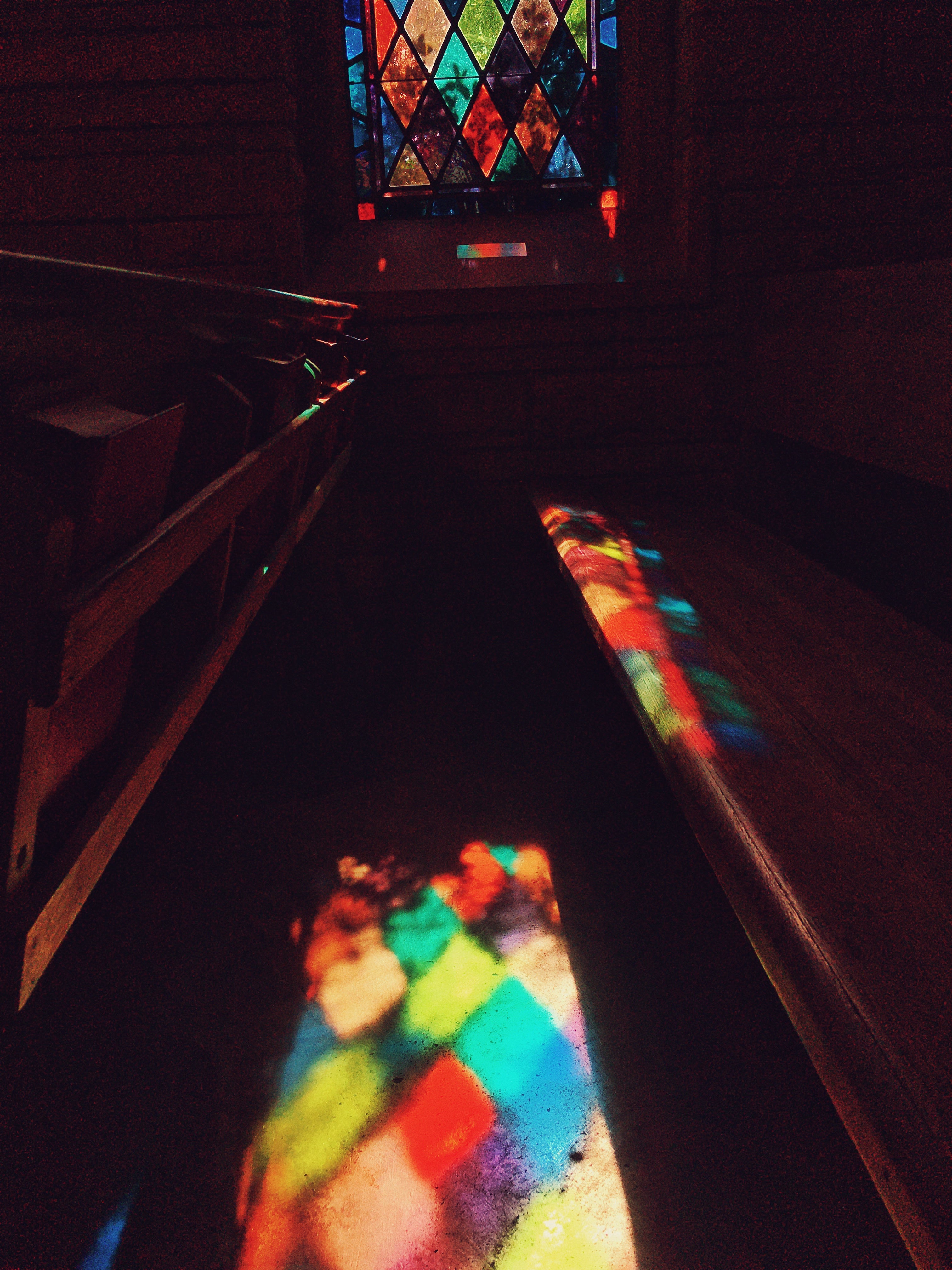 Light through Stained Glass on Pew